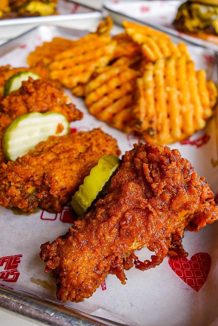 Nashville HOT Wings and Waffle Fries.