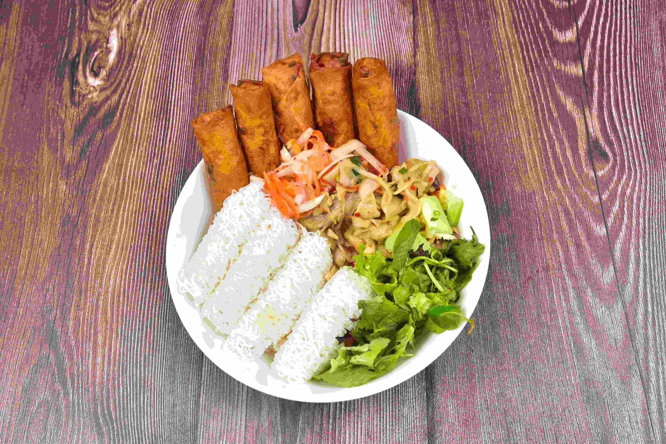 B6. Spicy Golden Nest Bowl - Pork & Shrimp Egg Rolls.