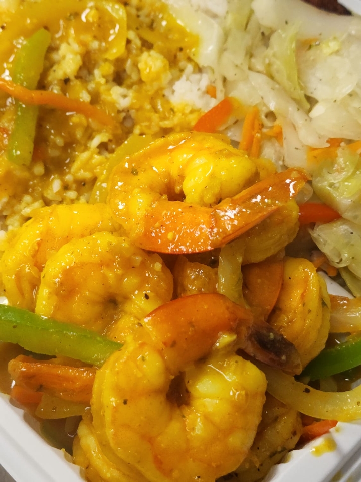 Curry Shrimp Meal (Shrimp simmered in well seasoned coconut curry sauce with herbs and onions, bell peppers, carrots).