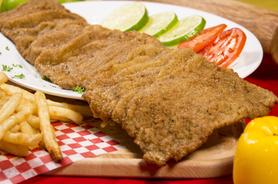 Chuleta valluna con arroz.