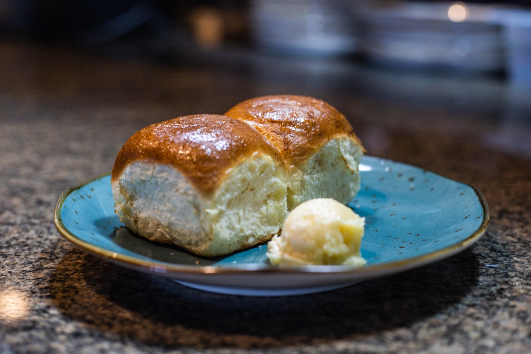 (2) Dinner Rolls with Honey Butter.