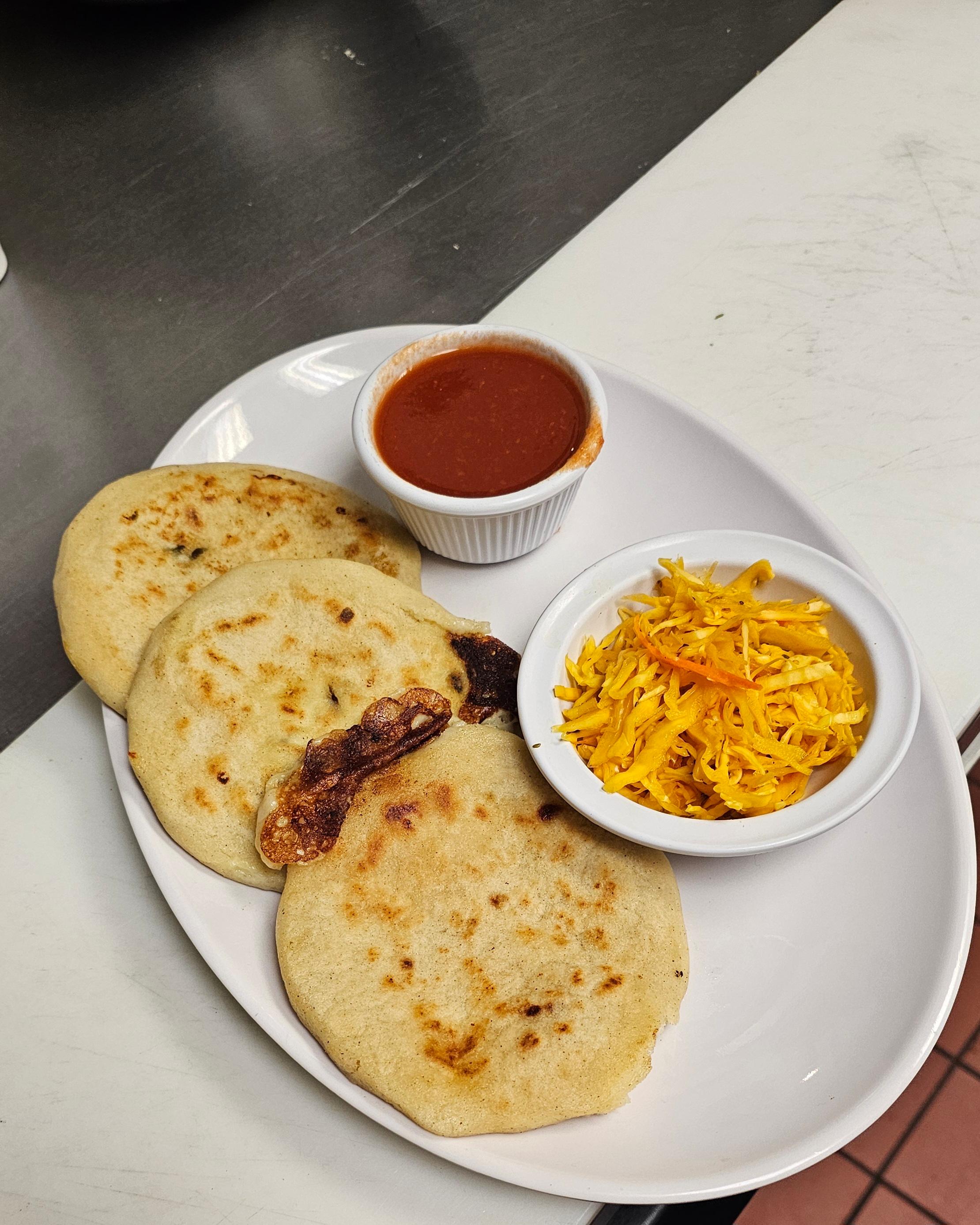 Pupusa Revuelta (Pork and Cheese).
