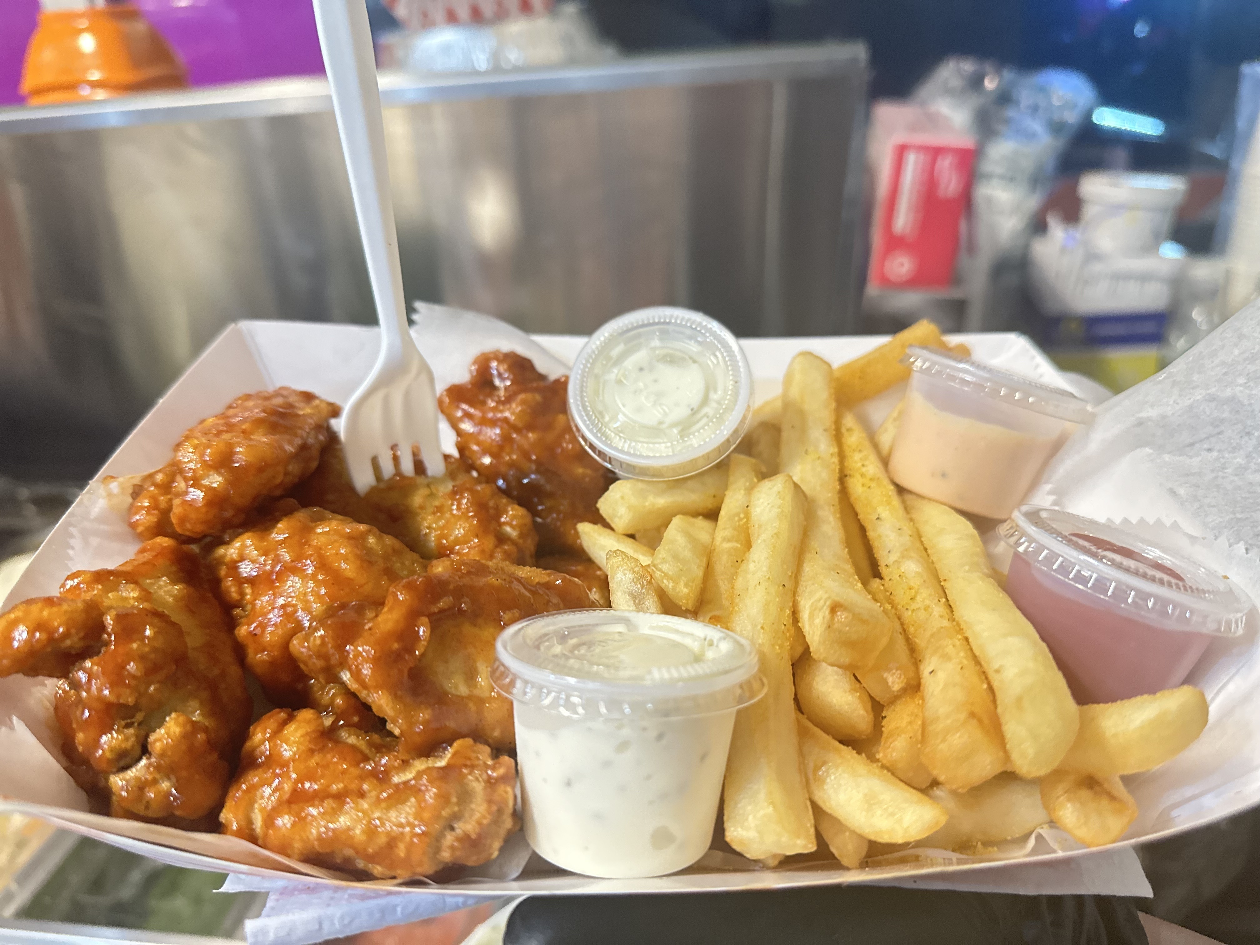 Mexican Chicken Wings with fries.
