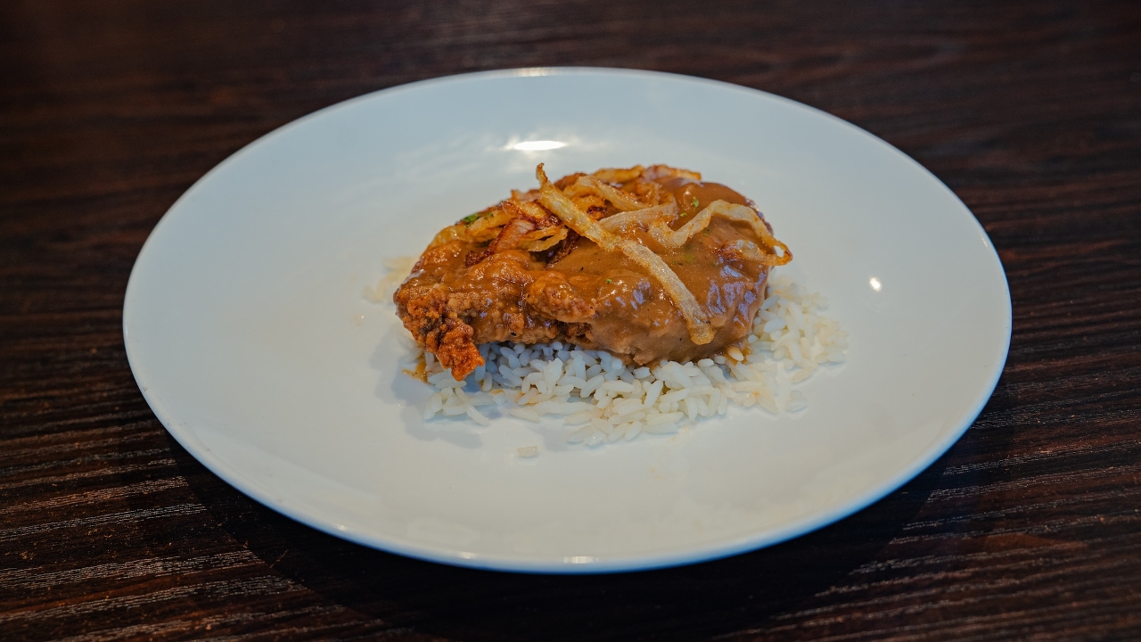 (1) SMOTHERED PORK CHOP.