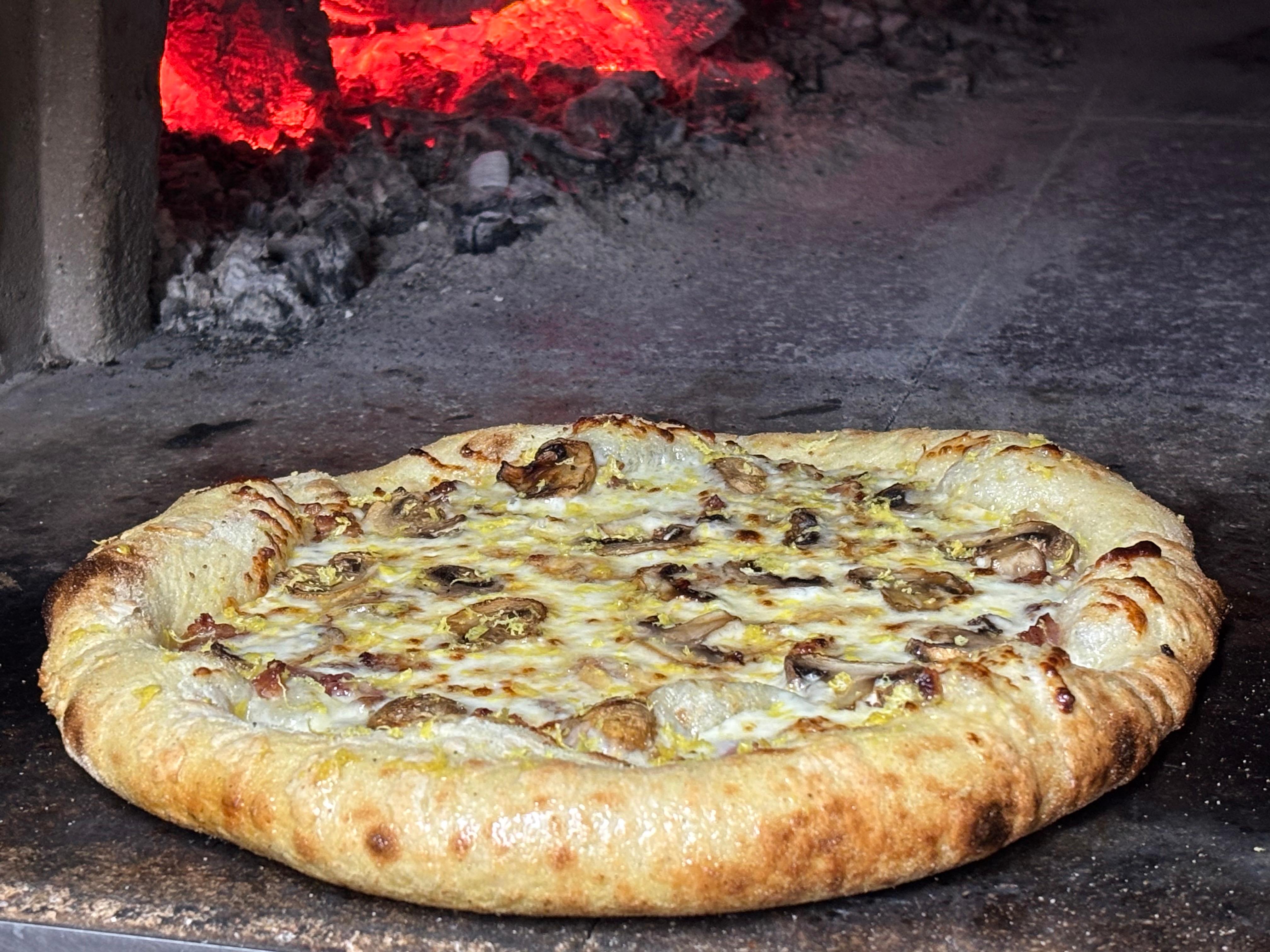 Funghi Bacon Pizza (Mushroom, Bacon, Alfredo, Citris zest).