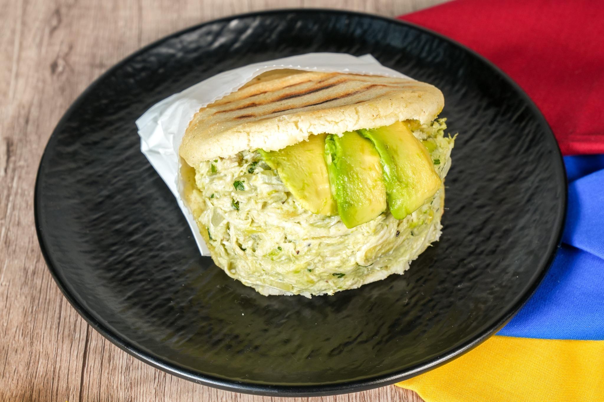 Chicken Avocado salad Arepa.