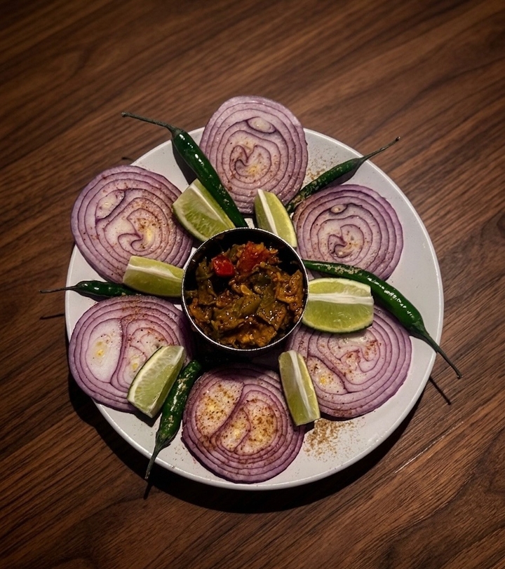 Side of Onion Chilly Pickle.