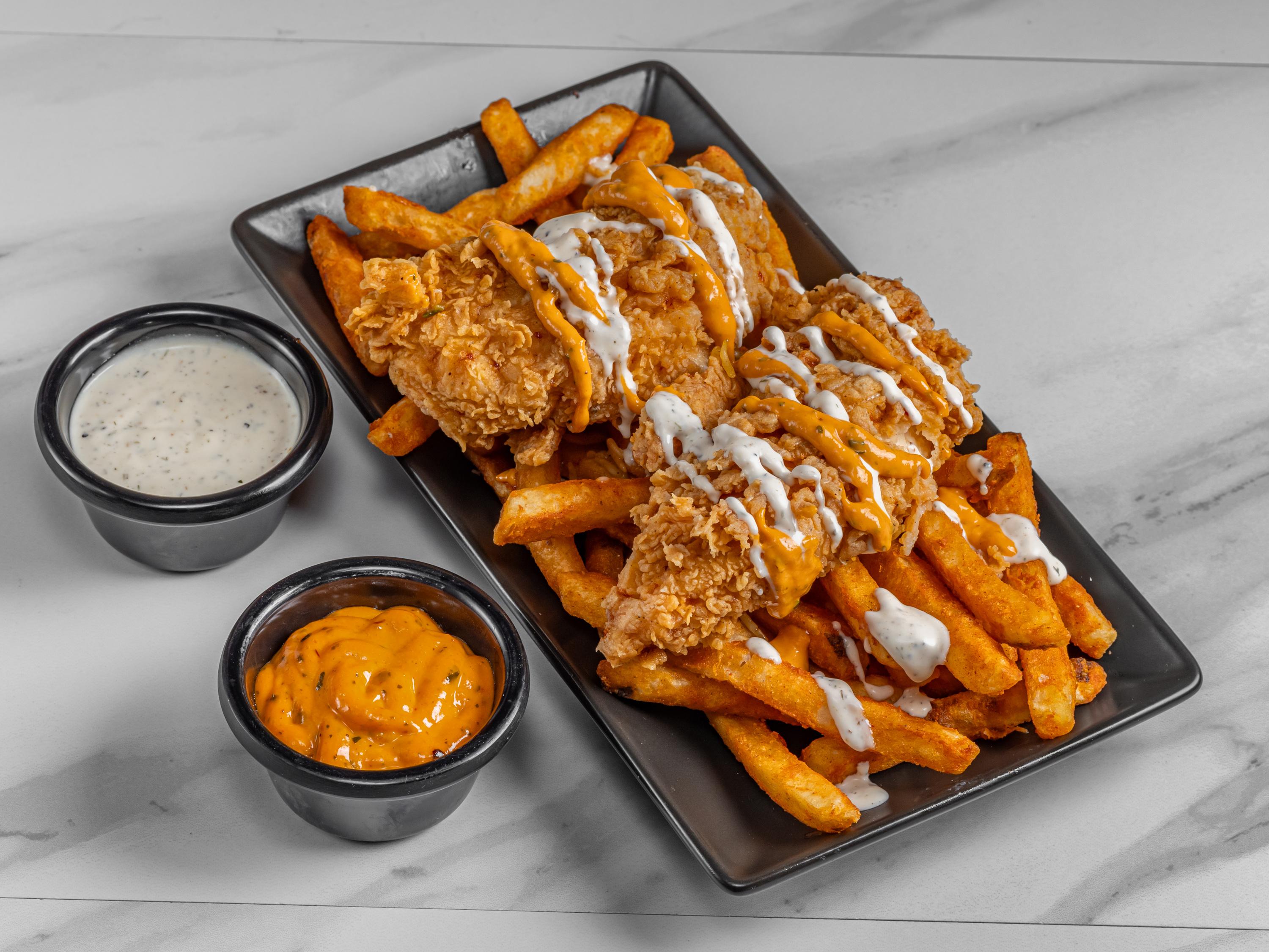 Fried tender over fries.