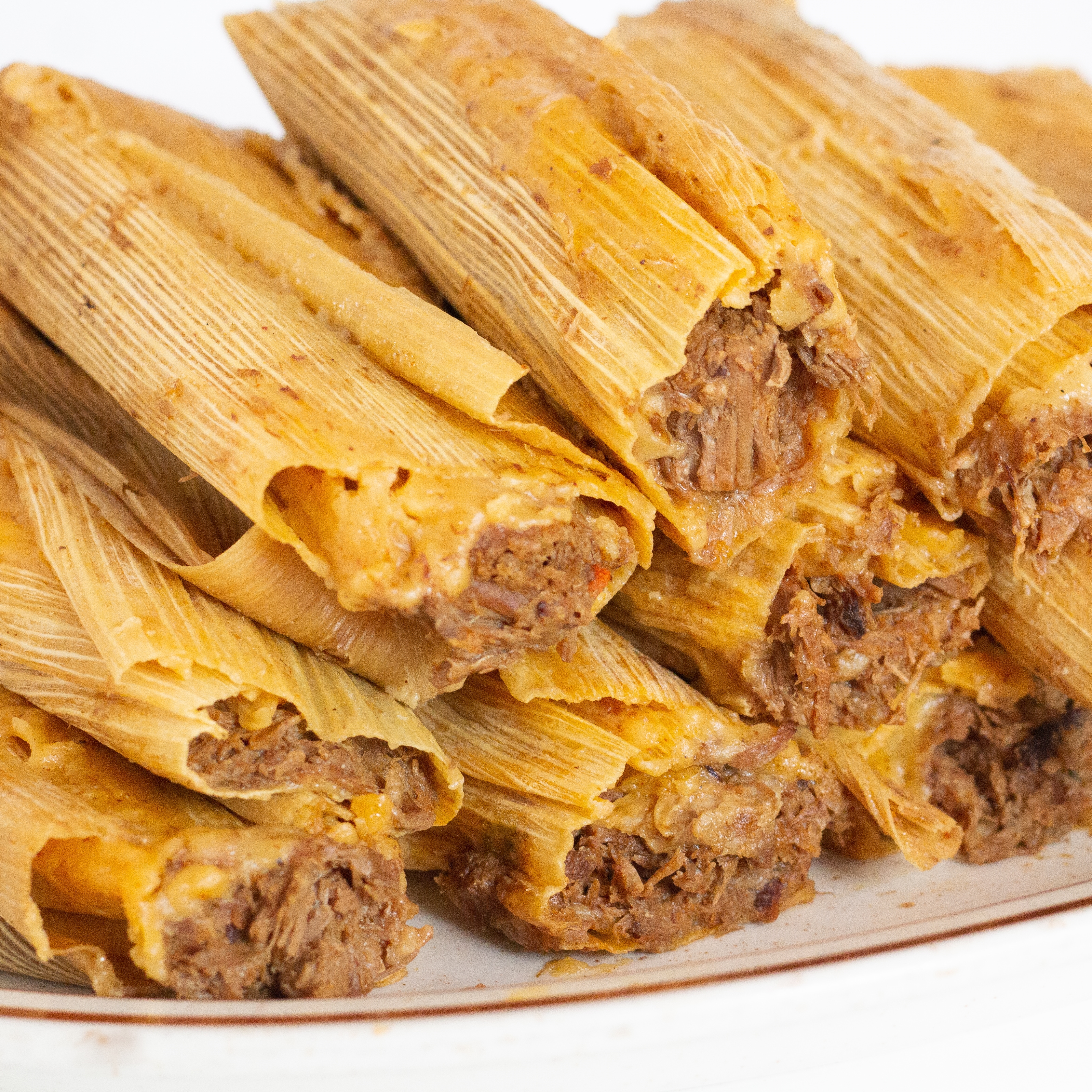 Large Tamales by the Half Dozen.