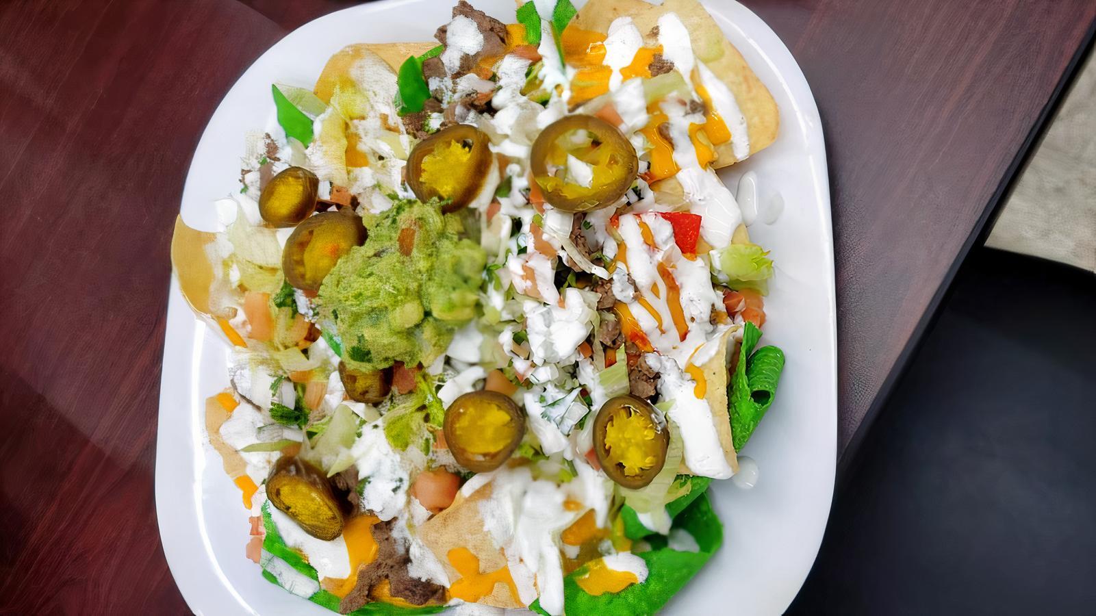 El Primo Special Super Deluxe Steak Nachos Cheese.