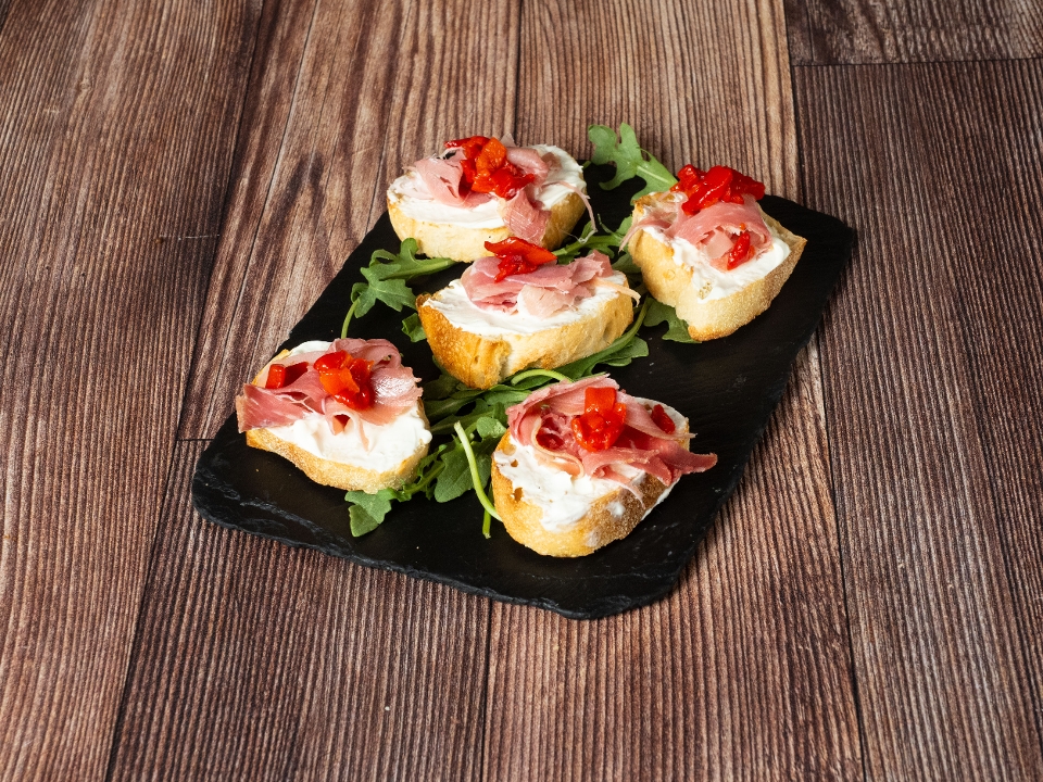 Creamy Brie & Prosciutto Crostini.