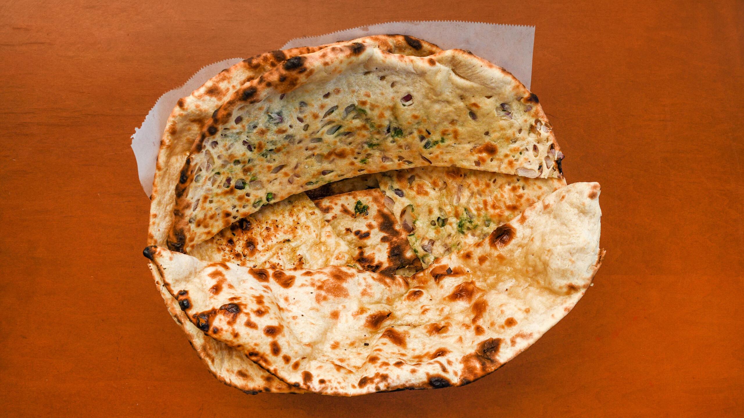 Bread Basket (Onion Kulcha, Plain Naan, & Garlic Naan).