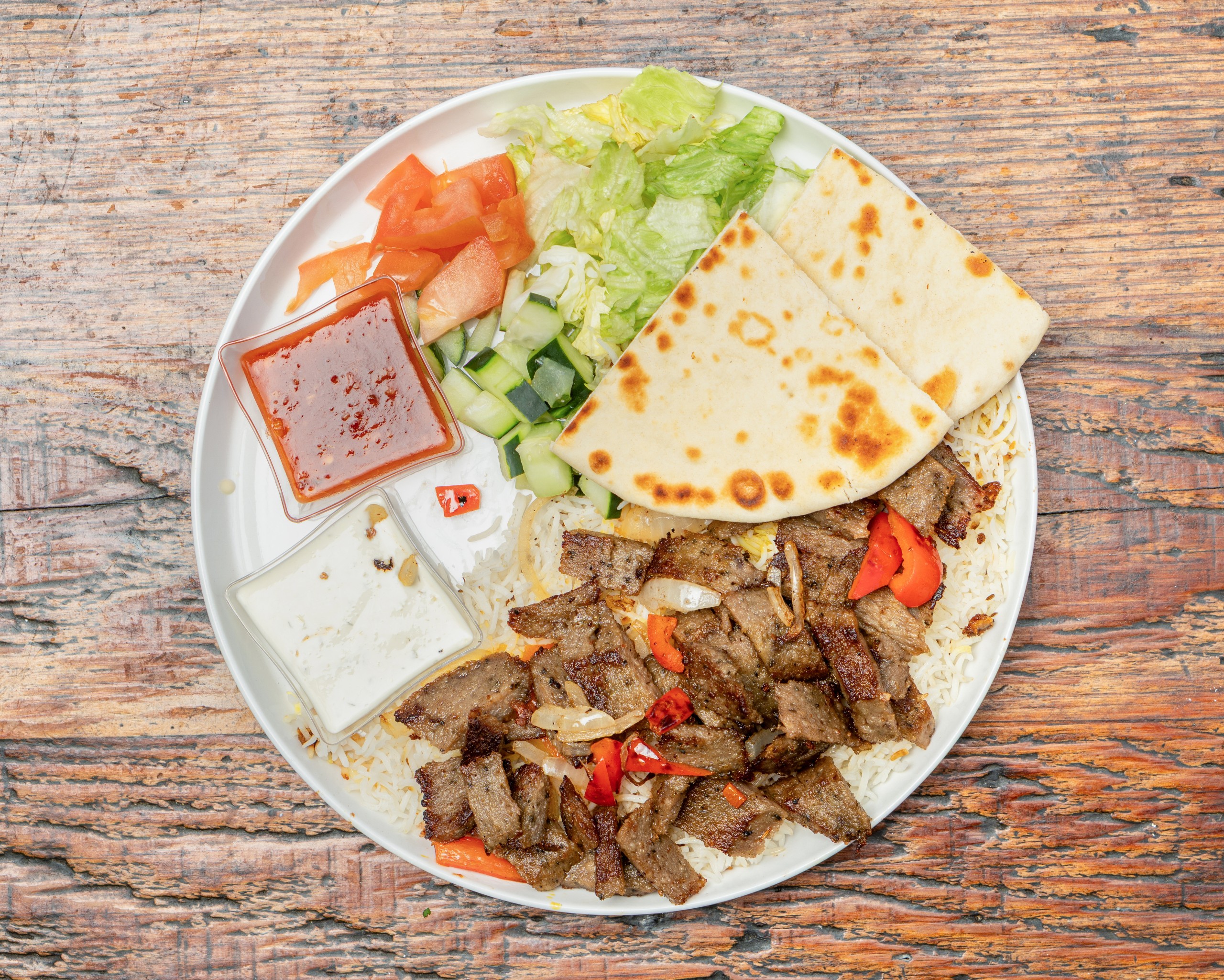 Plate (choose protein + rice + salad + pita ).