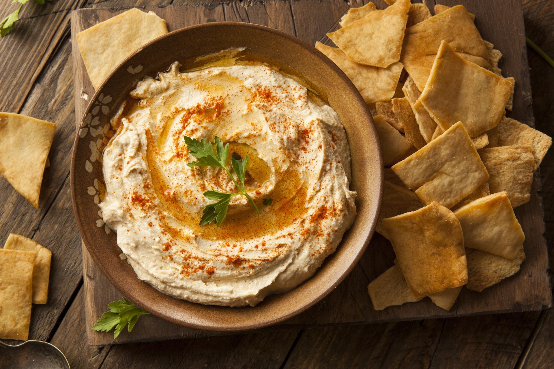 Hummus with pita wedges.