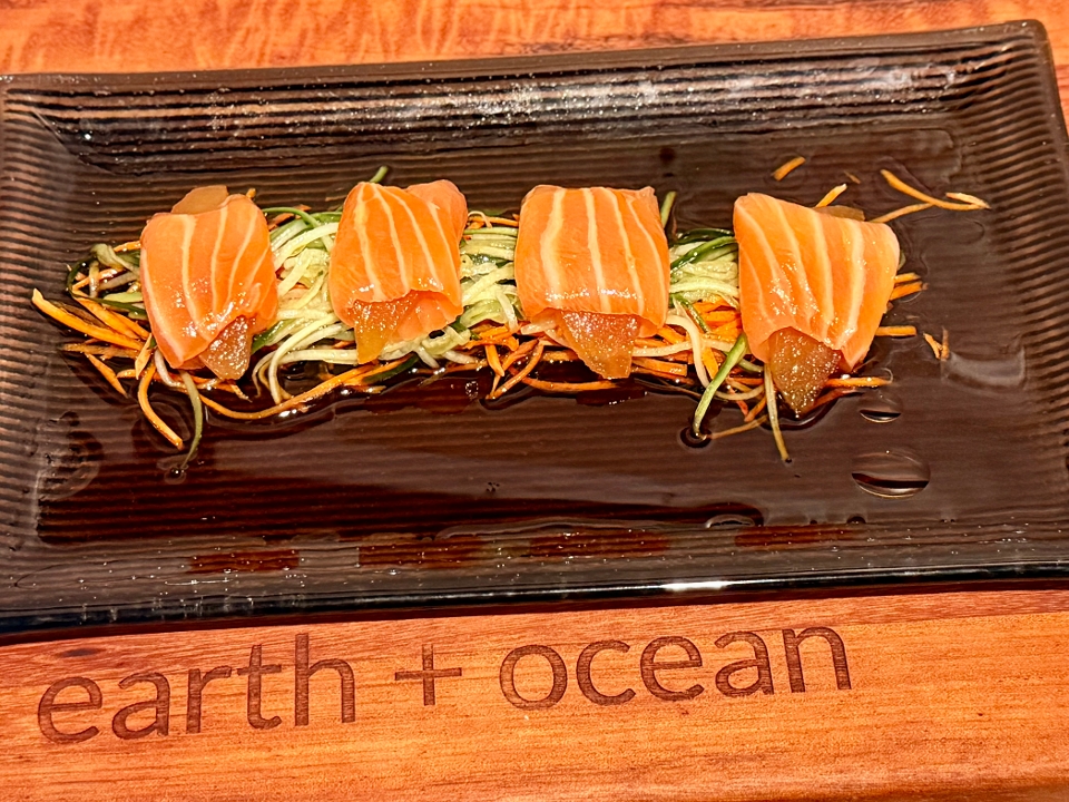 Poached Pear wrapped in thin, sliced salmon.