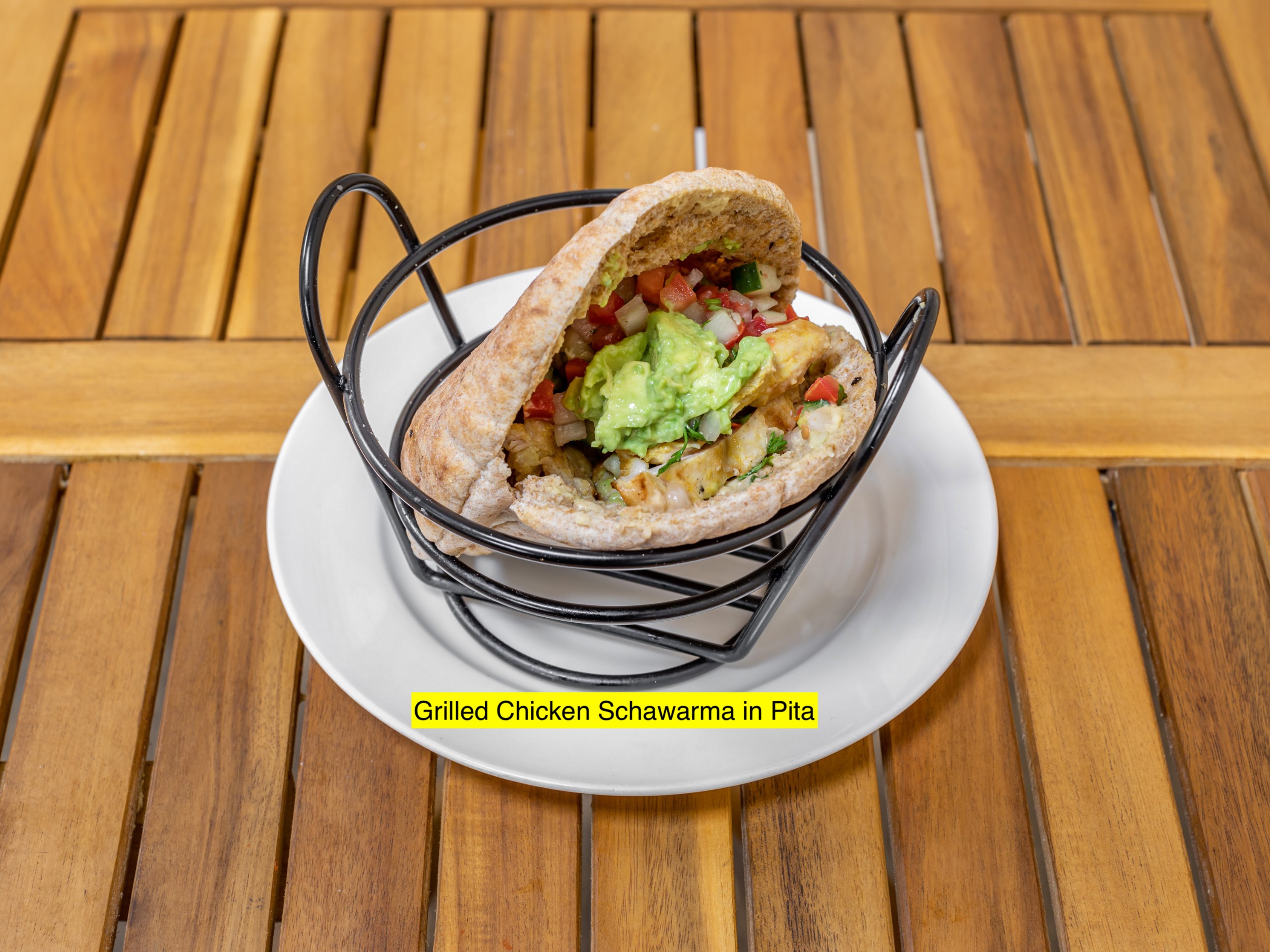 Grilled Chicken Shawarma Avocado Hummus, Israeli Salad, Tahini.