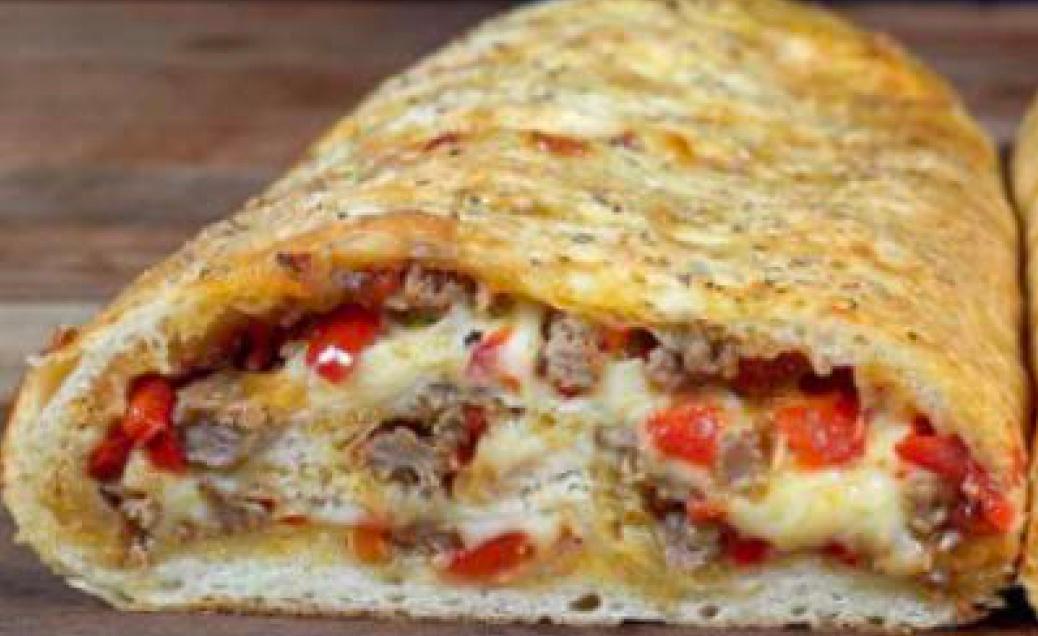 FAMILY STYLE SAUSAGE & PEPPER STROMBOLI.