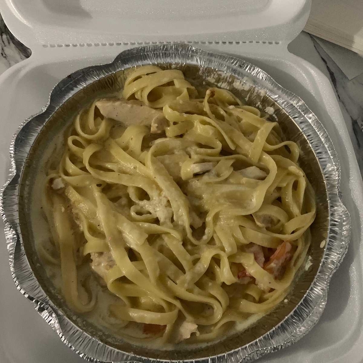 Penne with chicken and shrimps.