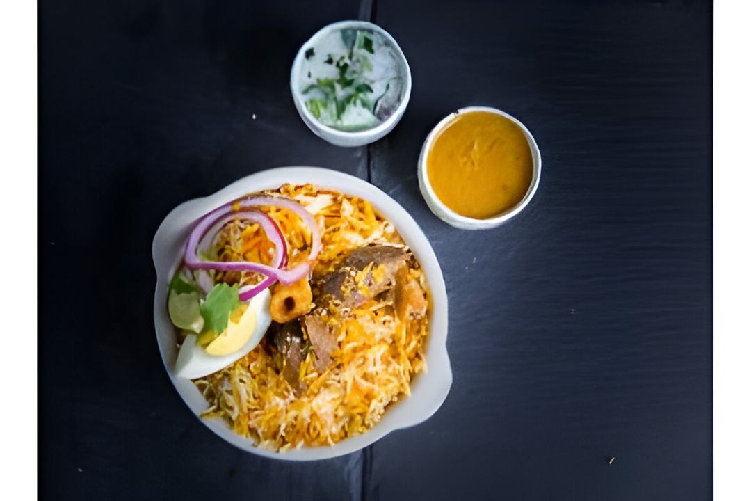 Tempered Goat Dum Biryani.