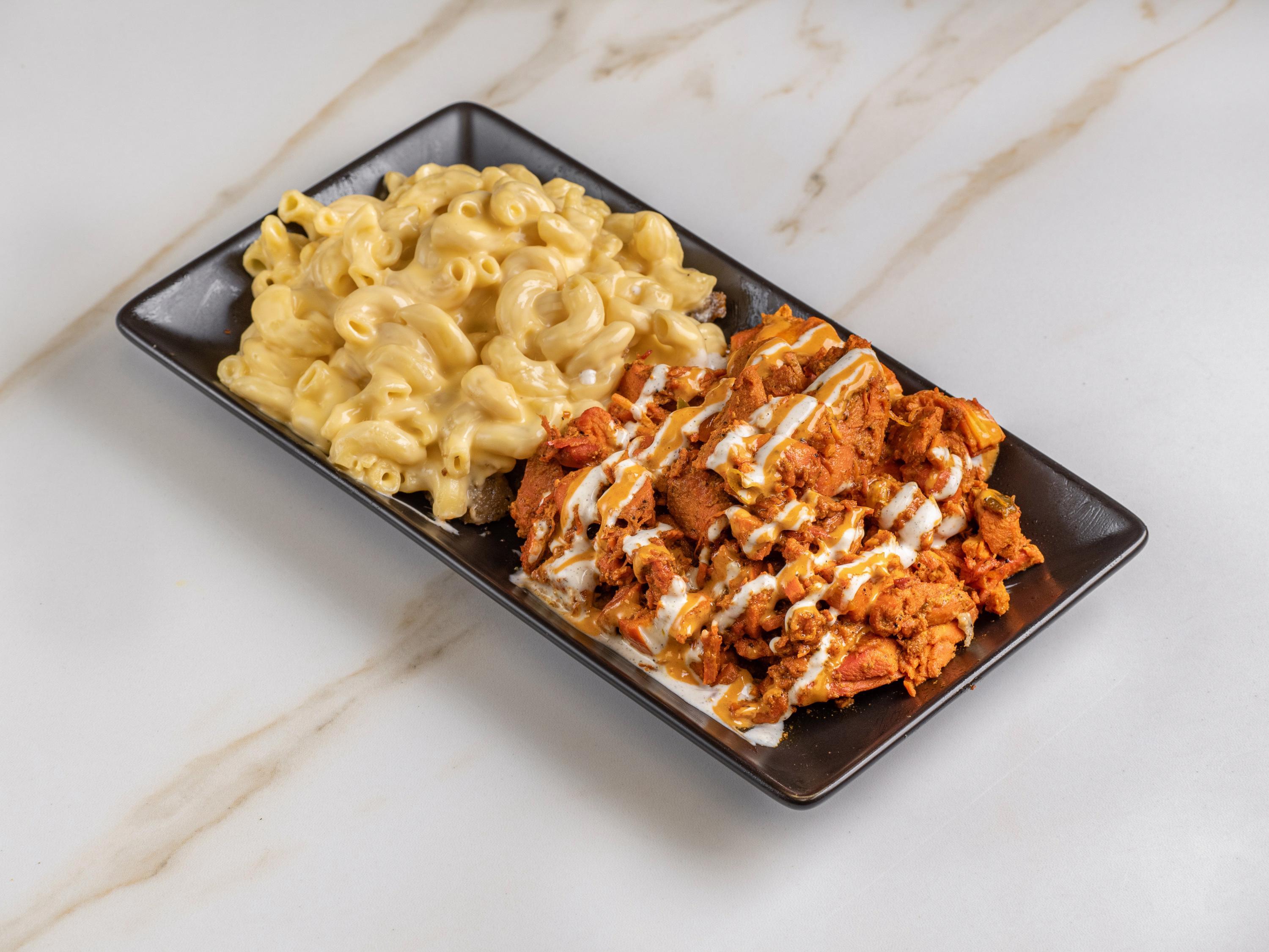 Chicken Over Mac & Cheese.